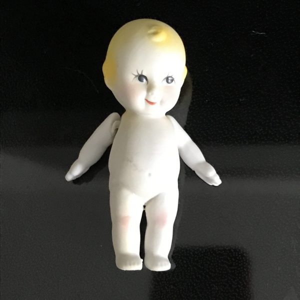 Vintage Kewpie doll with moveable arms miniature bisque detailed coloring farmhouse collectible display retro decor