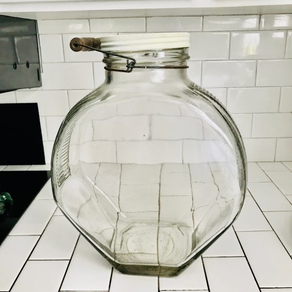 Antique Giant Drugstore jar Kitchen Storage ribbed glass metal lid wire handle with wood top collectibles display apothecary tv movie prop