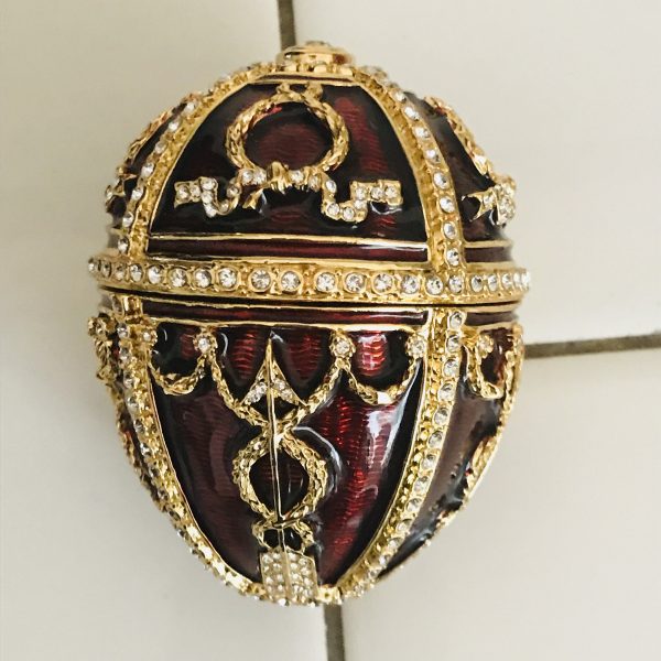 Beautiful Egg Enameled with enameled flower inside and necklace Swarovski crystals AKM St. Petersburg Russia Collectible display burgundy