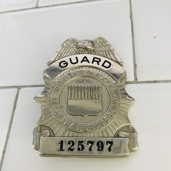 Obsolete Guard Badge Burns International Security Services #125797 collectible memorabilia display silver tone with blue