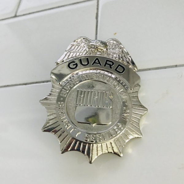 Obsolete Guard Badge Burns International Security Services collectible memorabilia display silver tone with blue