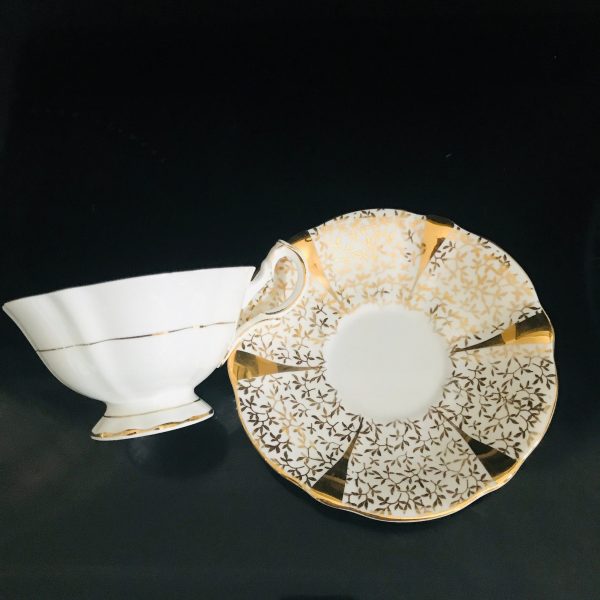 Queen Anne tea cup and saucer England Fine bone Gold with White and gold leaves Wedding Anniversary fine detail stunning heavy gold display