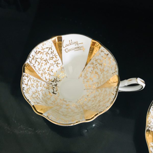 Queen Anne tea cup and saucer England Fine bone Gold with White and gold leaves Wedding Anniversary fine detail stunning heavy gold display