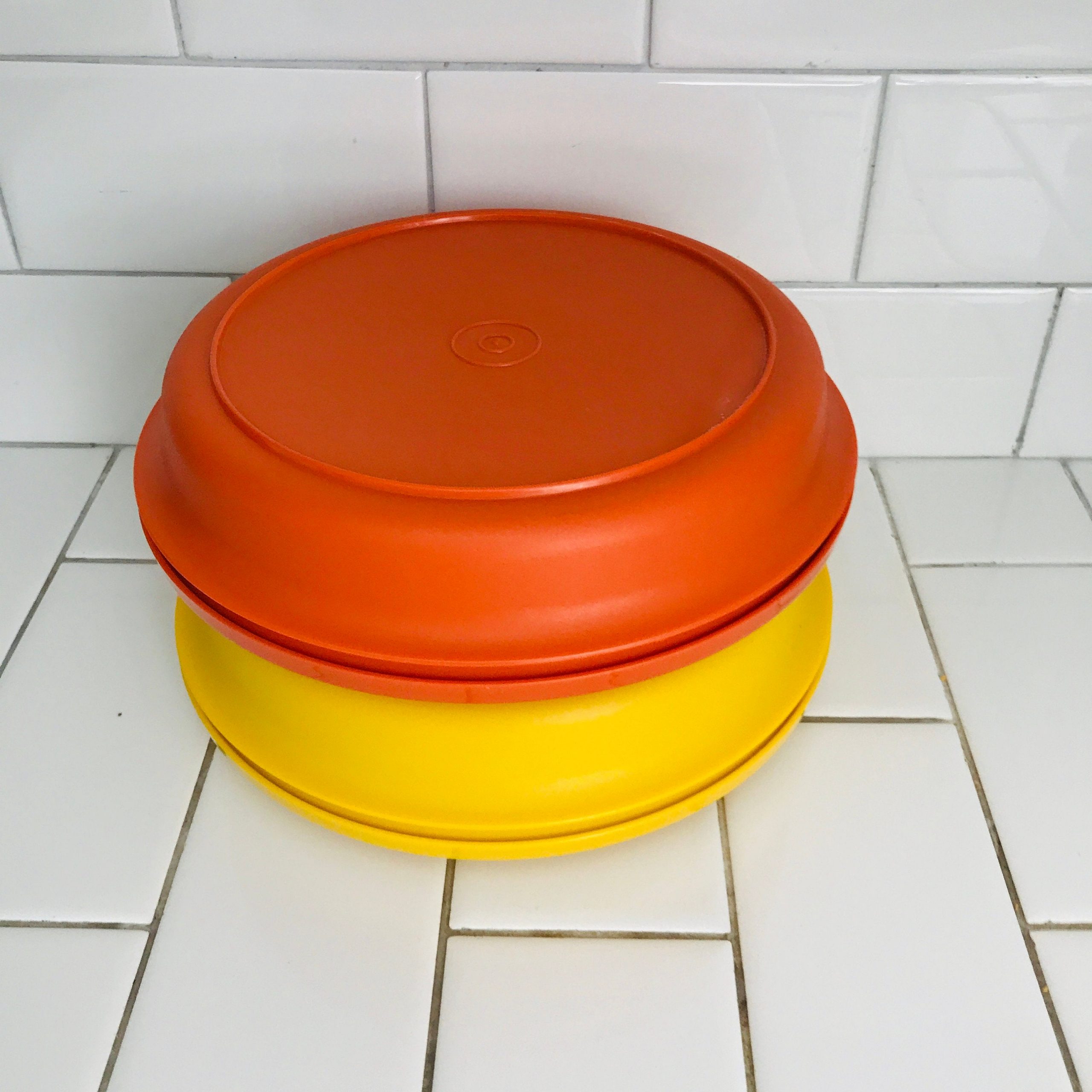 https://www.truevintageantiques.com/wp-content/uploads/2020/06/set-of-two-vintage-tupperware-seal-and-serve-bowls-vintage-harvest-colors-collectible-display-kitchen-storage-farmhouse-cottage-5eee7c2d5-scaled.jpg