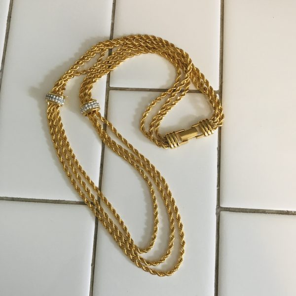 Vintage Beautiful Nolan Miller 3 strand gold tone rope necklace with crystal encrusted clasps at centers