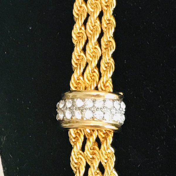 Vintage Beautiful Nolan Miller 3 strand gold tone rope necklace with crystal encrusted clasps at centers