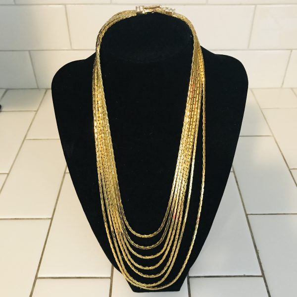 Vintage Beautiful Nolan Miller 7 strand gold tone necklace with crystal encrusted clasp quality vintage jewelry