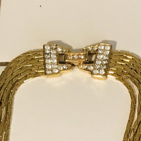 Vintage Beautiful Nolan Miller 7 strand gold tone necklace with crystal encrusted clasp quality vintage jewelry