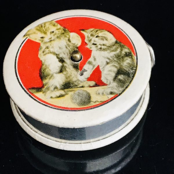 Vintage Sewing Notions 1950's Kitten Tape measure collectible display metal with yellow cloth measurer MINT condition round