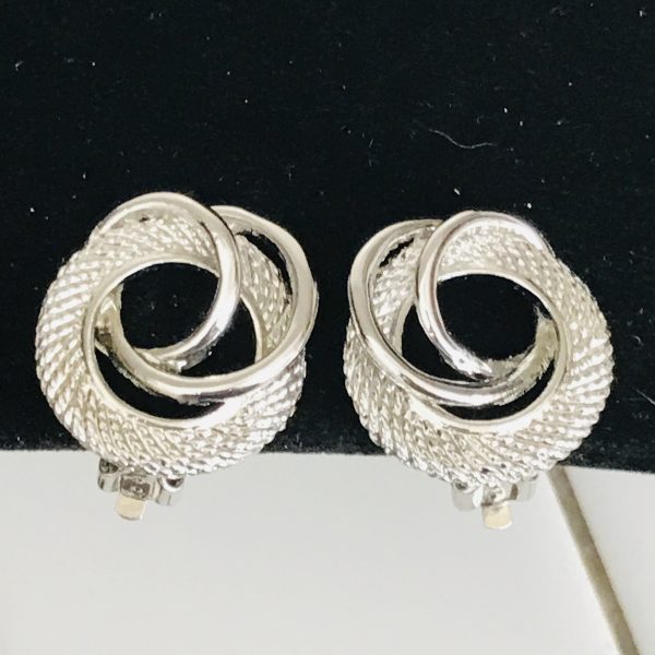 Vintage Silver tone Round  clip earrings ribbed and sleek circles intertwined