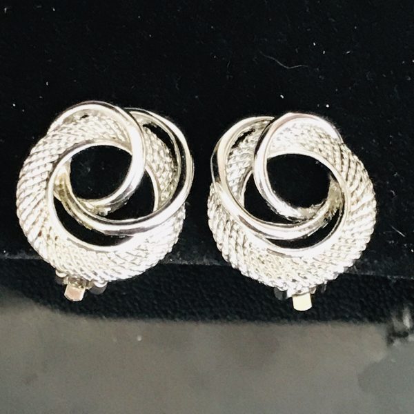 Vintage Silver tone Round  clip earrings ribbed and sleek circles intertwined