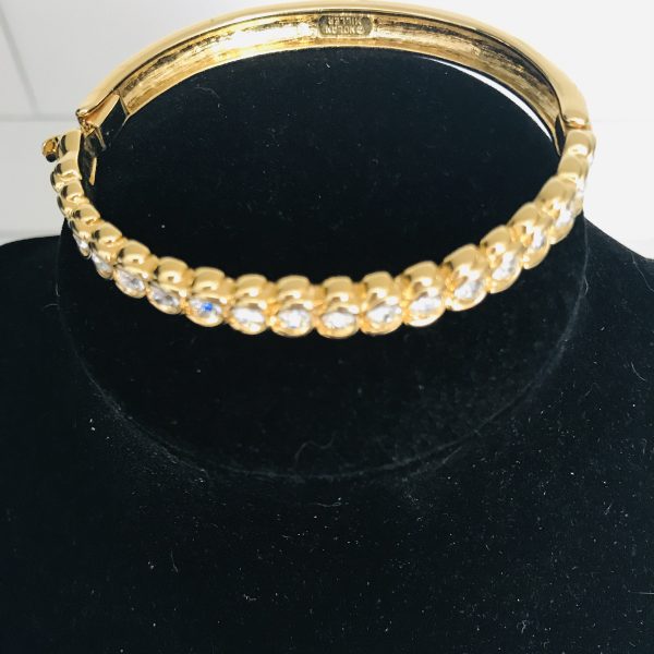 Vintage bracelet stunning Nolan Miller signed bangle individually set Crystals in gold tone metal with slide clasp  2 1/4" across
