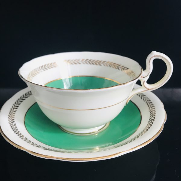 Tea cup and saucer Aynsley England Fine bone china green rim gold trim farmhouse collectible display coffee bridal