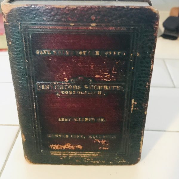 Vintage locking book bank made for storing money in a secret way metal with lock and leather binding 1923