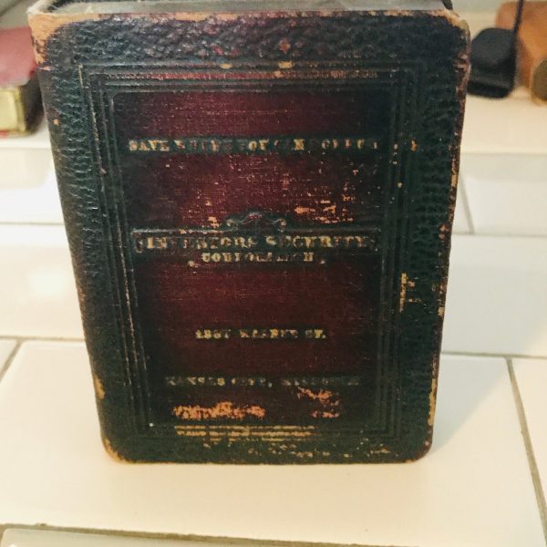 Vintage locking book bank made for storing money in a secret way metal with lock and leather binding 1923