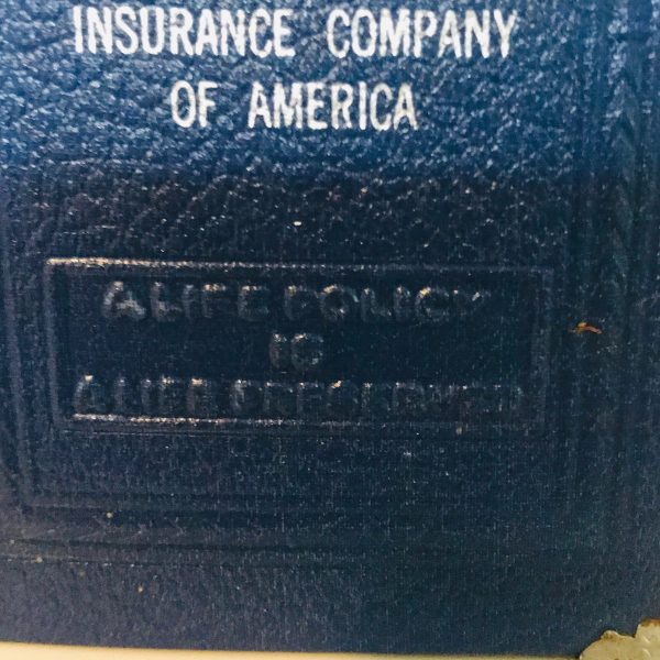 Vintage locking book bank made for storing money in a secret way metal with lock and leather binding Life insurance company of America