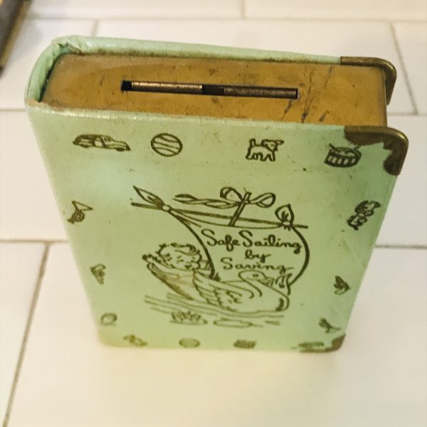 Vintage locking book bank made for storing money in a secret way metal with lock and leather binding Safe sailing by savings