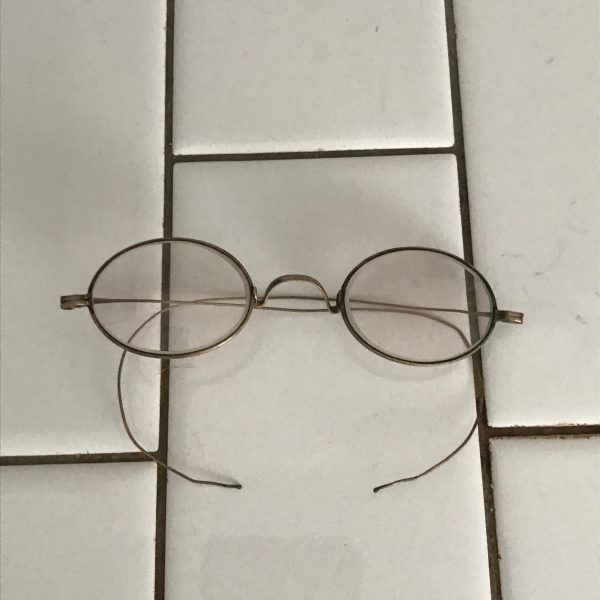 Antique eyeglasses Child size thin wire bows glass lenses wire rims collectible display farmhouse bed and breakfast turn of the century