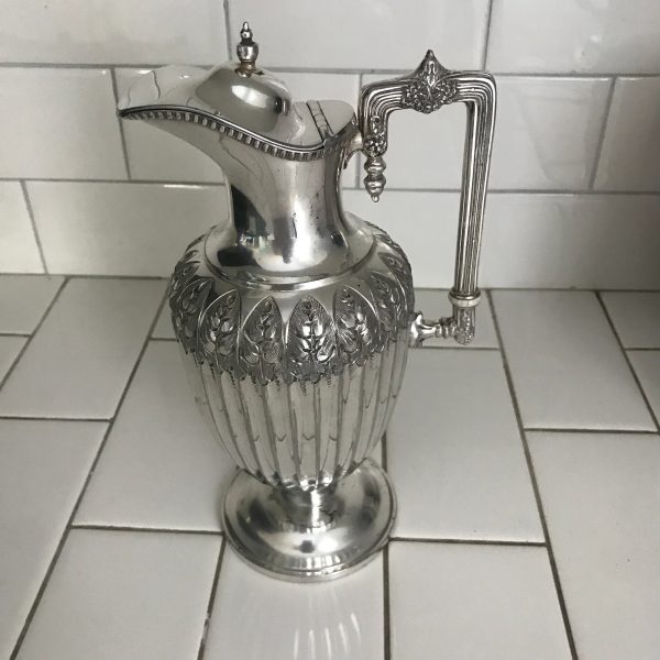 Stunning Wine Pitcher Victorian ornately detailed ribbed body with extremely ornate hand chased pattern around the top square handle display