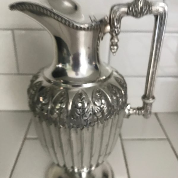 Stunning Wine Pitcher Victorian ornately detailed ribbed body with extremely ornate hand chased pattern around the top square handle display