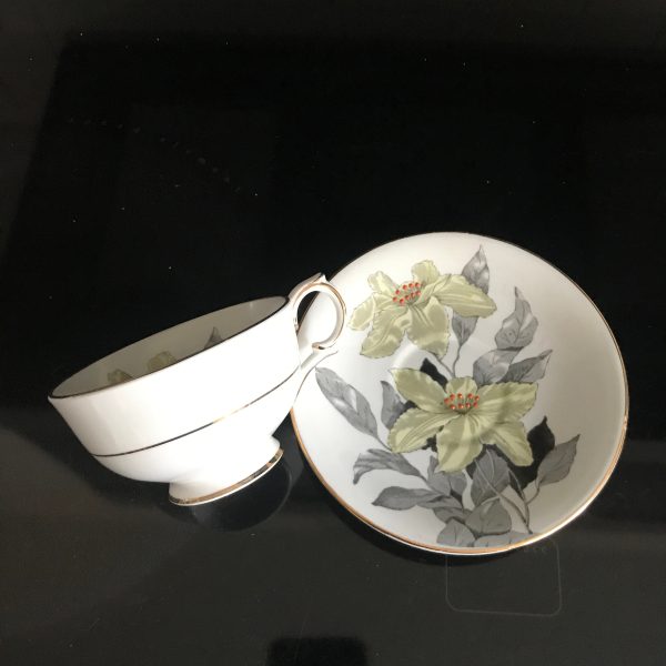 Clarence Windsor tea cup and saucer England Fine bone china Green & Orange Trillium gray leaves gold trim farmhouse collectible display