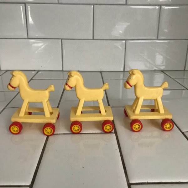Darling 1986 McDonalds rolling horses set of 3 great birthday cake toppers plastic yellow and orange rolling hard plastic collectible