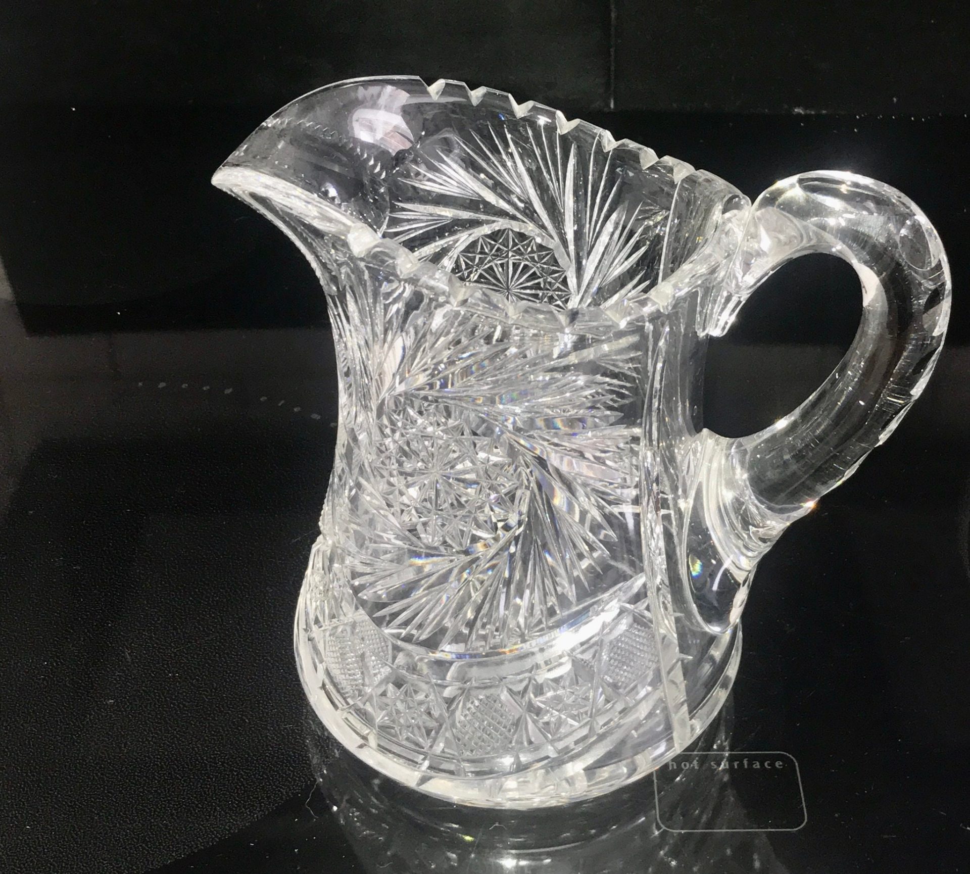 https://www.truevintageantiques.com/wp-content/uploads/2022/05/antique-american-brilliant-cut-crystal-pitcher-beautiful-large-cut-rim-and-handle-mint-condition-7-1-4-tall-collectible-display-elegant-629176762-scaled.jpg